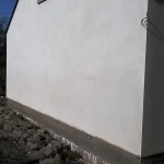Smooth new plastered wall with open top window
