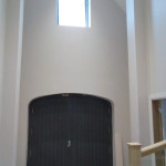 Finished plastering with double black door
